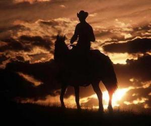 Układanka Cowboy jazda o zmierzchu