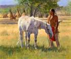 Indiańskiego wojownika z koniem w pobliżu obozu