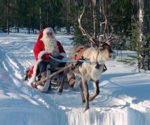 Układanka Santa Claus w jego sanie z reniferami na śniegu